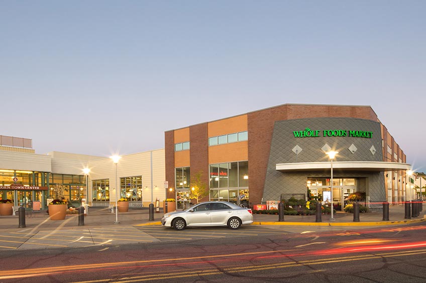 Image of Bergen Town Center shopping center with various shops and parking spaces.