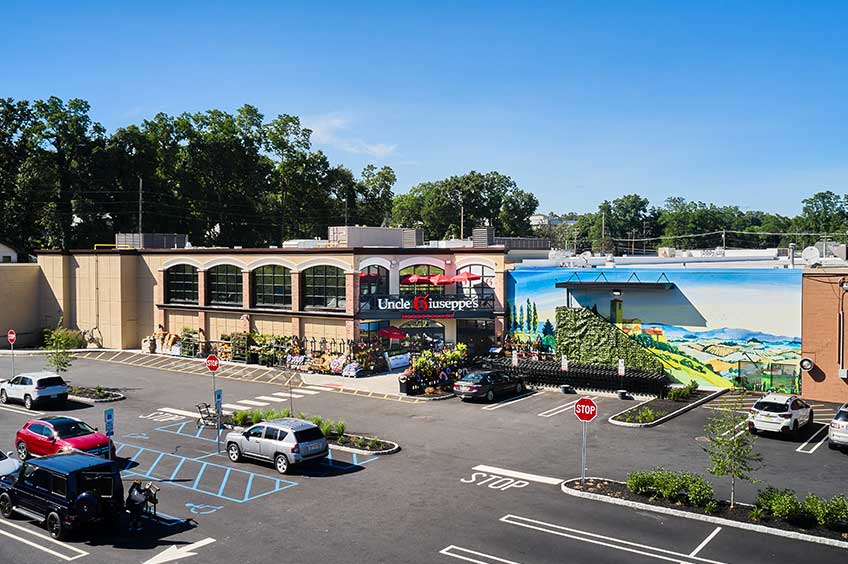 Detailed view of Briarcliff Commons shopping center with various stores.