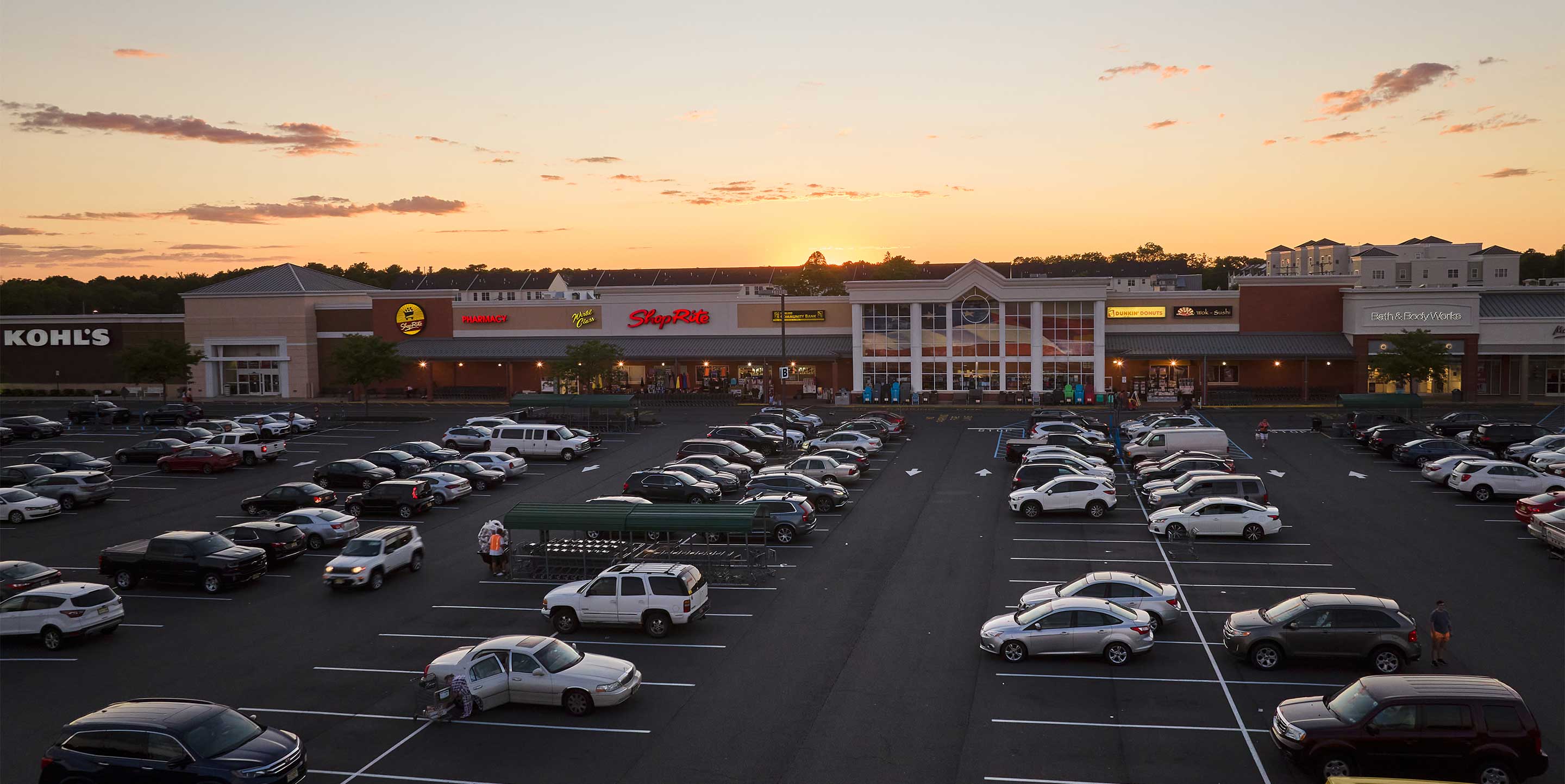 Image of Bergen Town Center shopping center with various shops and parking spaces.