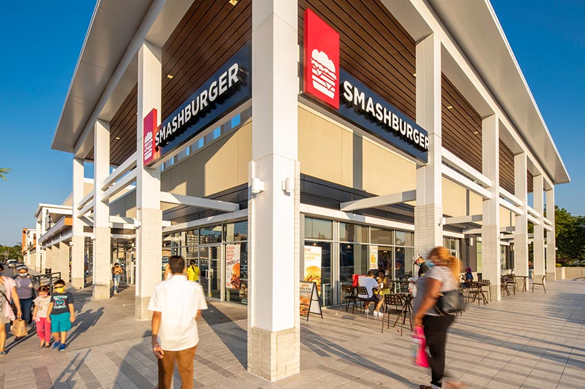 View of Bruckner Commons shopping center with various stores.