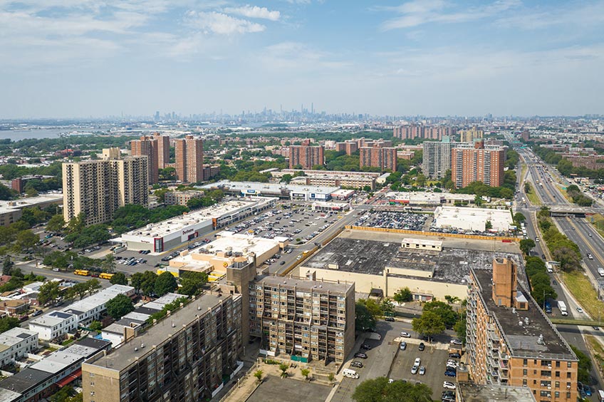 Overhead shot of Broomall Commons shopping center and its adjacent parking lot, captured from a high vantage point.