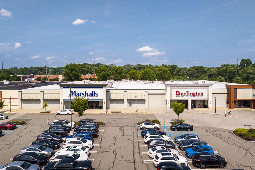 Storefront 2 at Hanover Commons shopping center with various parking spaces.