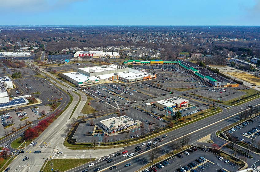 Aerial view of Plaza at Cherry Hill shopping center and its adjacent parking lot, captured from a high vantage point.