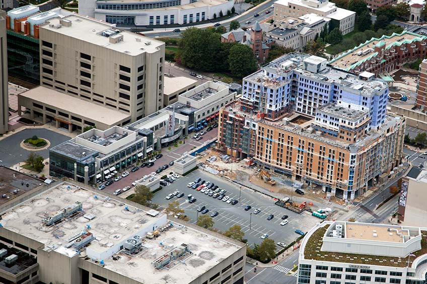 Aerial view of Rockville Town Center shopping center and its adjacent parking lot, captured from a high vantage point.