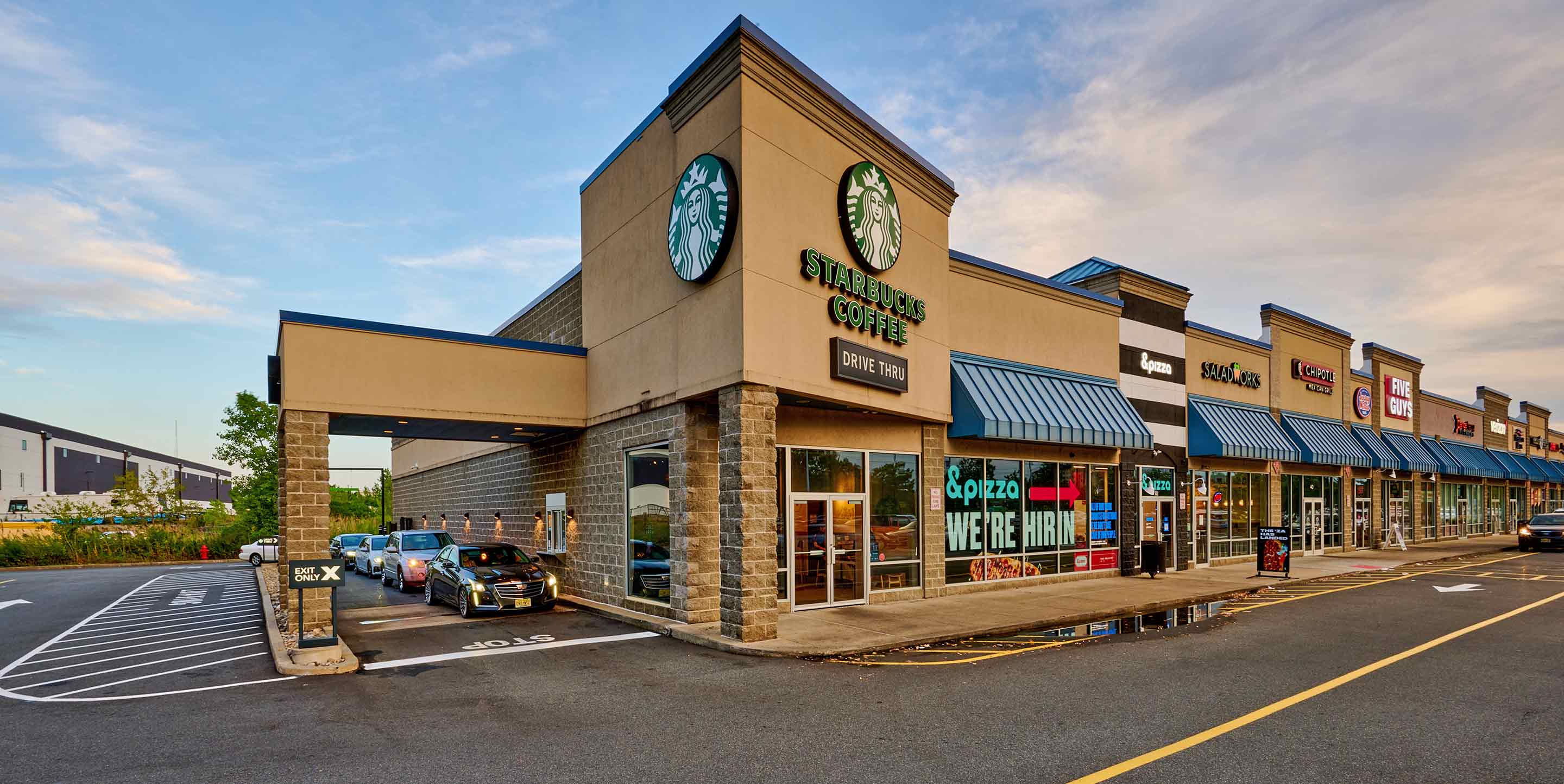 Image of Rutherford Commons shopping center with various shops.