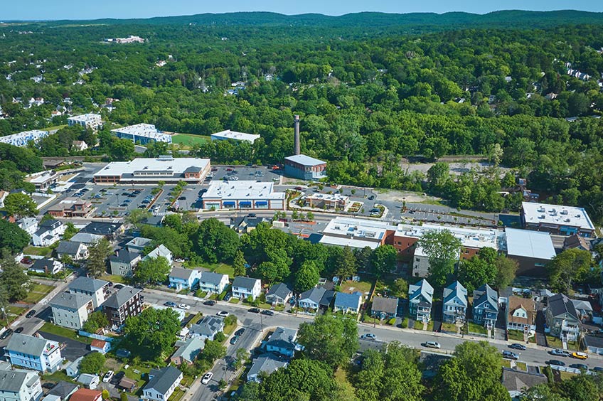 Aerial view of The Shops at Riverwood shopping center and its adjacent parking lot, captured from a high vantage point.