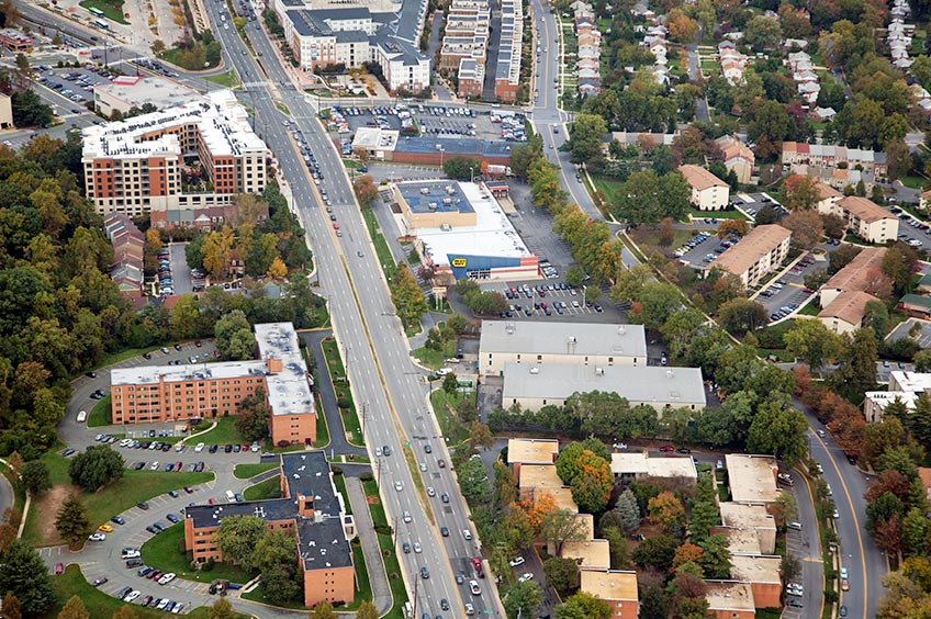 Aerial view of Wheaton shopping center and its adjacent parking lot, captured from a high vantage point.