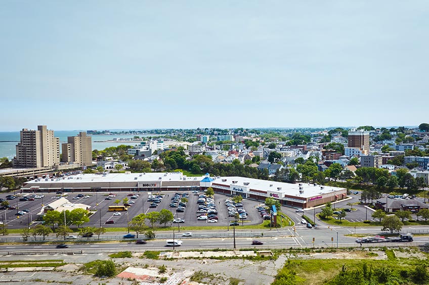 Aerial view of Wonderland Marketplace shopping center and its adjacent parking lot, captured from a high vantage point.