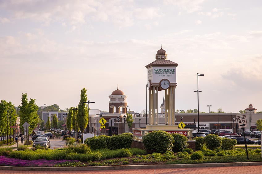 Detailed view of Woodmore Towne Centre shopping center with various stores.