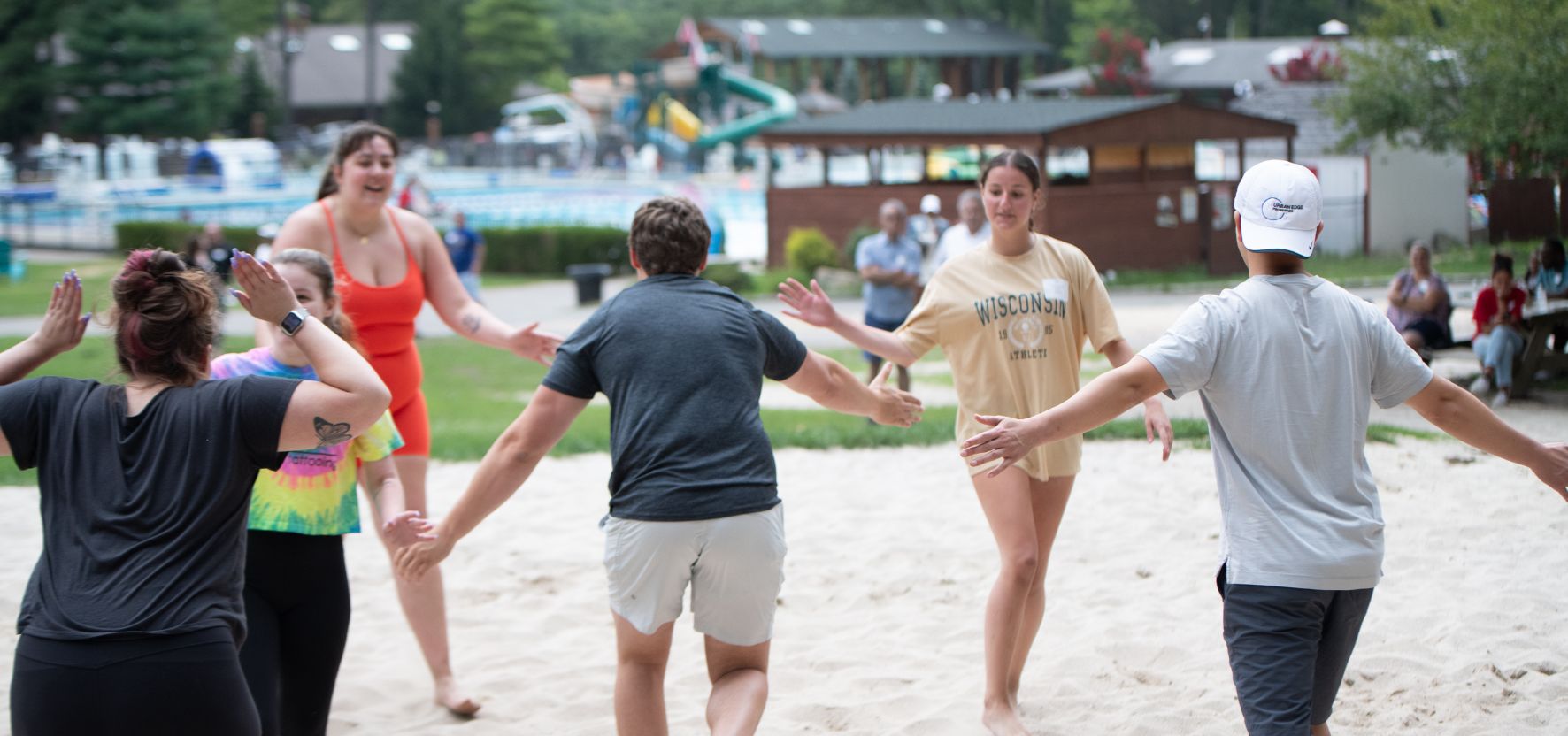 Staff members celebrating a win at an outdoor event