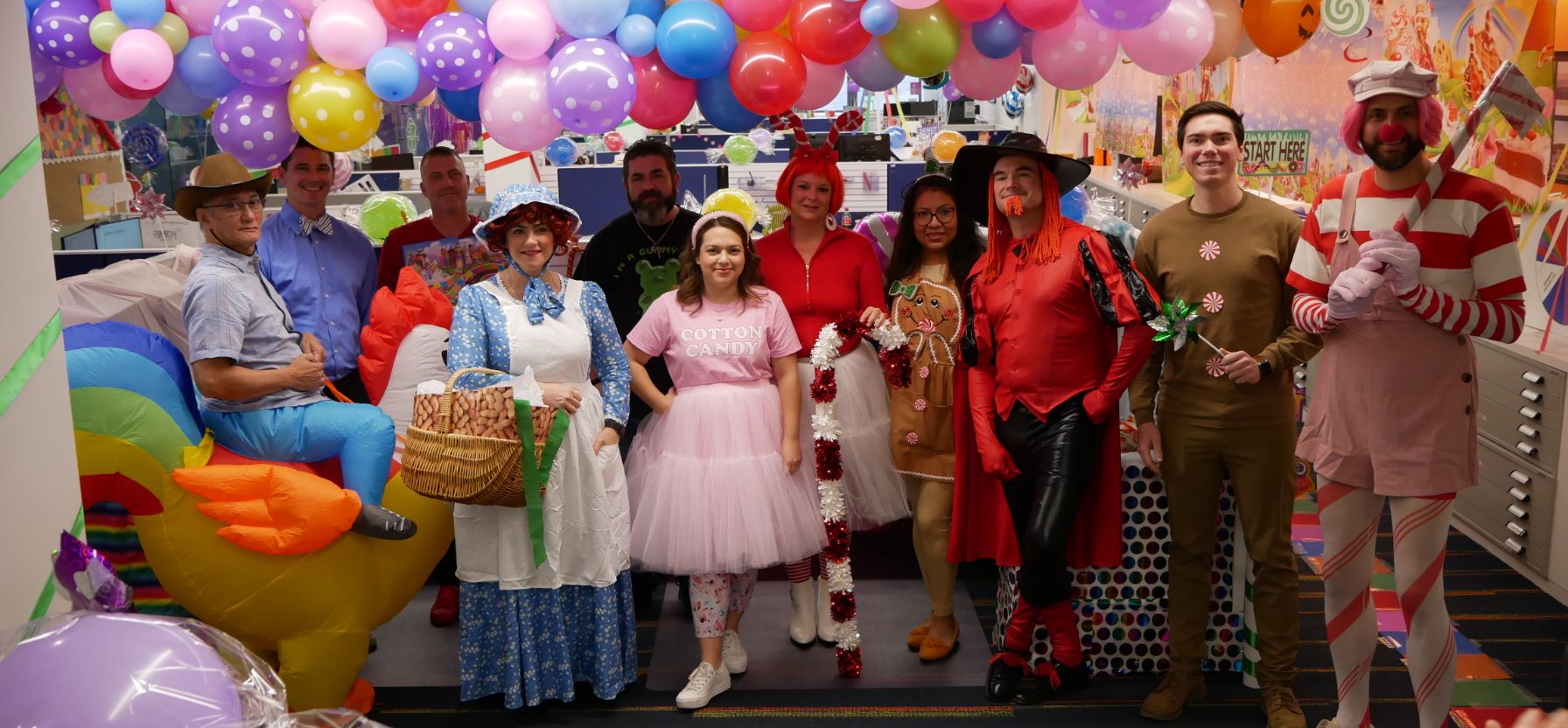 Group photo of staff members in costumes