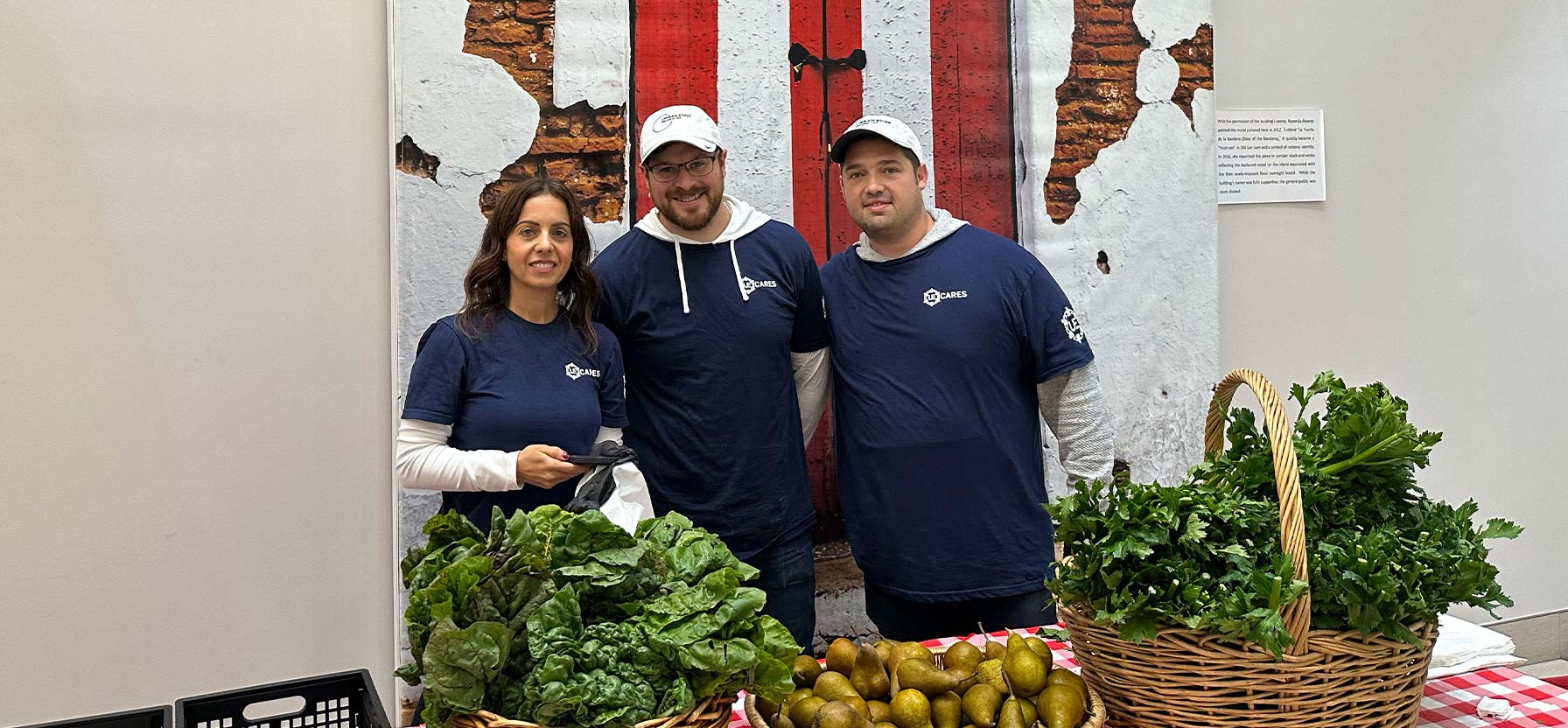 Staff members at a table with vegetables